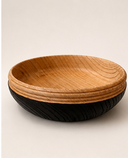 Two-tone ash bowl with scorched exterior and natural interior