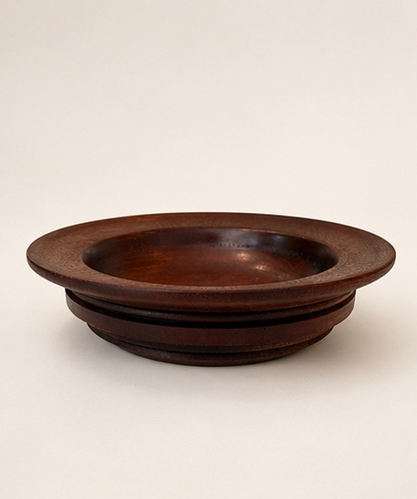 Rimmed mahogany dish with stepped base