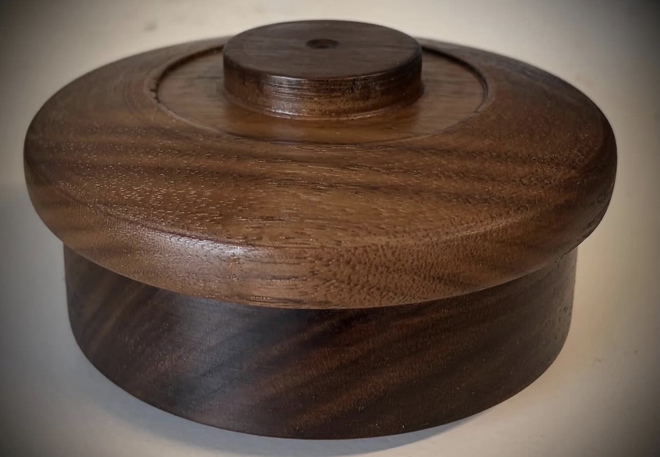 Lidded walnut turning with turned finial